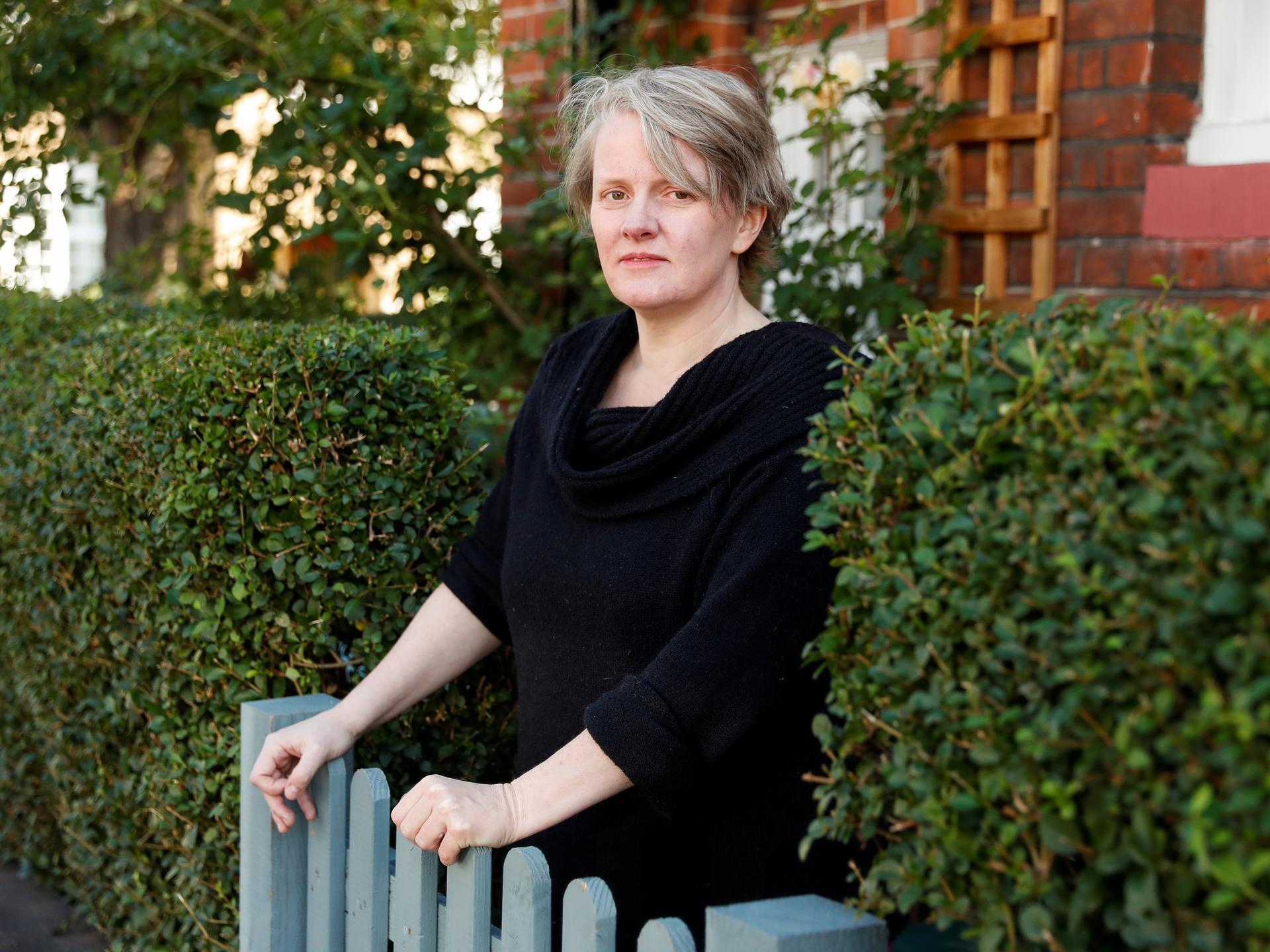 Felicity Callard, a 49-year-old British university professor and lecturer who continues to struggle with symptoms following a COVID-19 infection, poses after an interview at her house, in London, England, on September 2, 2020.
