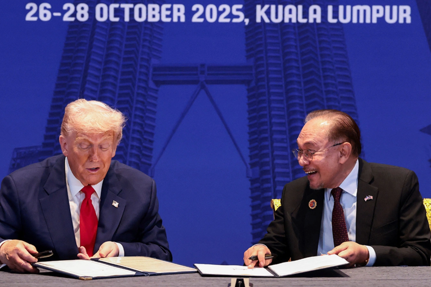 U.S. President Donald Trump and Malaysian Prime Minister Anwar Ibrahim sign trade deal documents during a bilateral meeting during the 47th Association of Southeast Asian Nations (ASEAN) summit in Kuala Lumpur, Malaysia, October 26, 2025. Evelyn Hockstein/Reuters