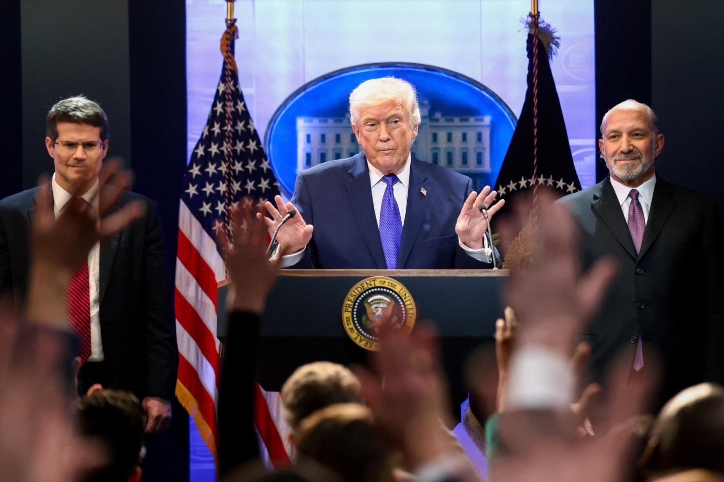 U.S. President Donald Trump, Secretary of Commerce Howard Lutnick and Solicitor General D. John Sauer at a White House press briefing following the Supreme Court’s ruling, February 20, 2026. 