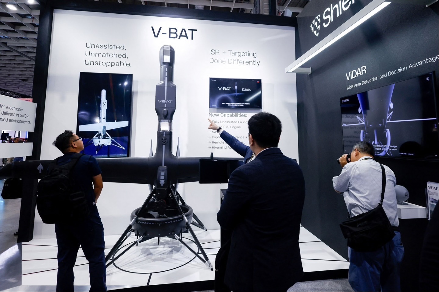 Visitors look at Shield AI’s V-BAT unmanned aerial vehicle on display during the Taipei Aerospace and Defence Technology Exhibition in Taipei, Taiwan, on September 18, 2025.
