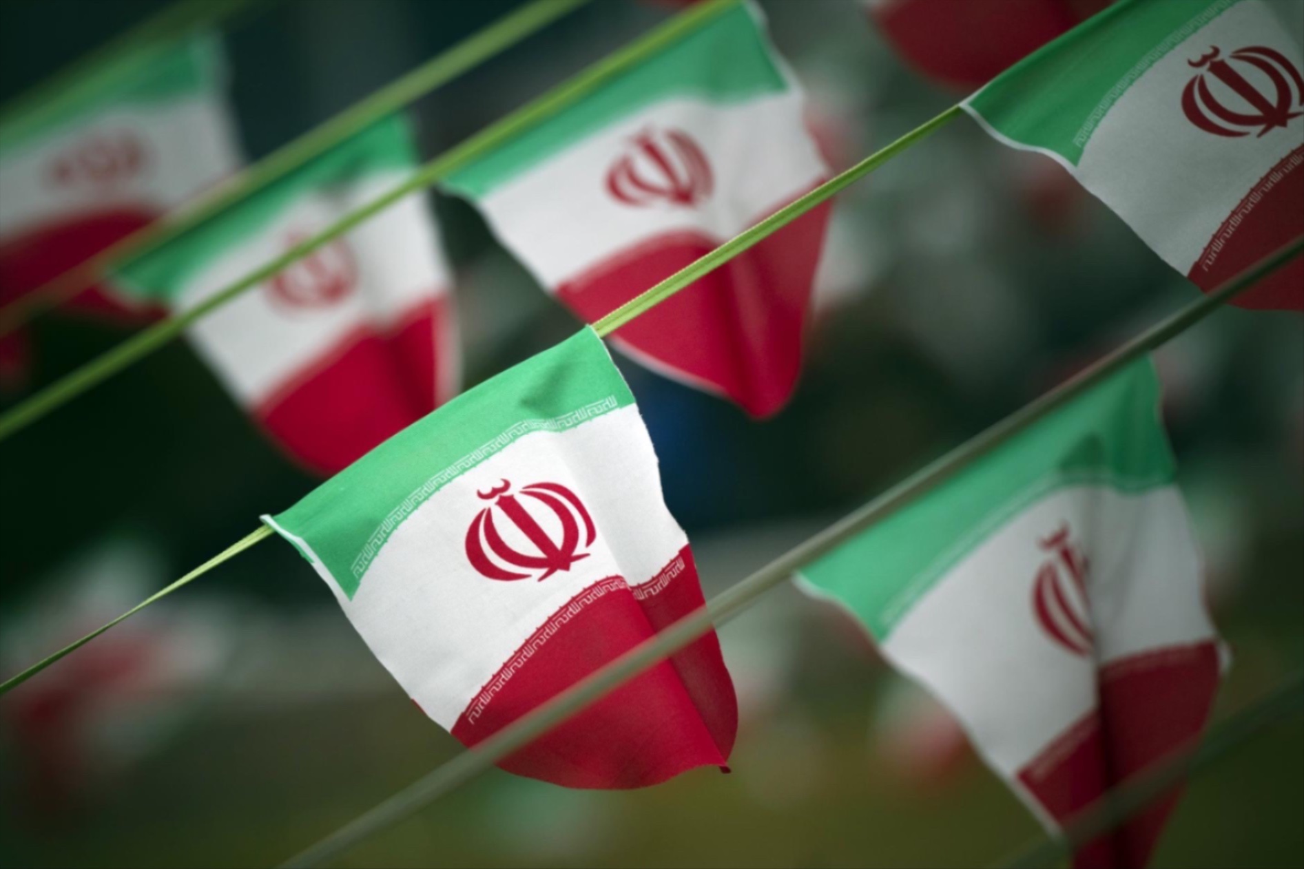 Iran's national flags are seen on a square in Tehran.