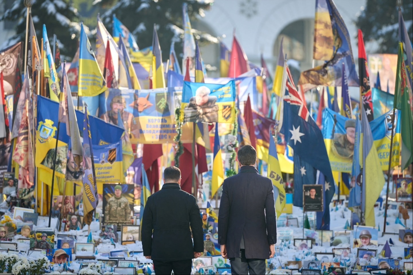 Ukrainian President Volodymyr Zelenskyy and NATO Secretary General Mark Rutte visit a makeshift memorial for fallen Ukrainian defenders in Kyiv, Ukraine.