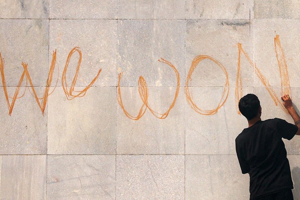 A demonstrator writes on the parliament building during a protest in Kathmandu, Nepal, September 9, 2025.