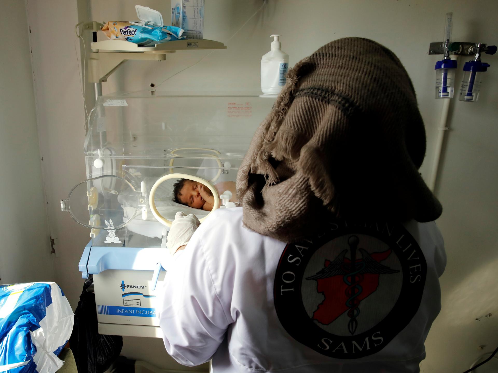 A nurse checks a premature baby at a maternity hospital, in Idlib, Syria, on February 27, 2020.