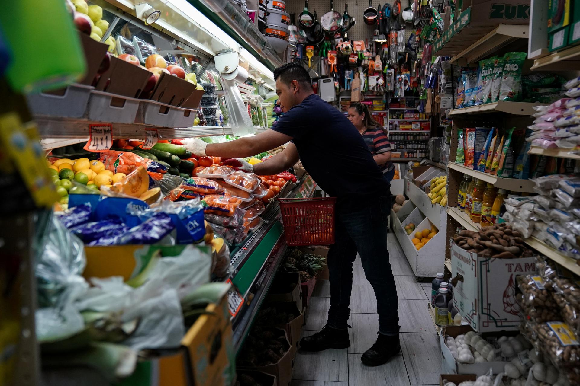 A person arranges groceries in El Progreso Market in the Mount Pleasant neighborhood of Washington, D.C., U.S., August 19, 2022. REUTERS/Sarah Silbiger
