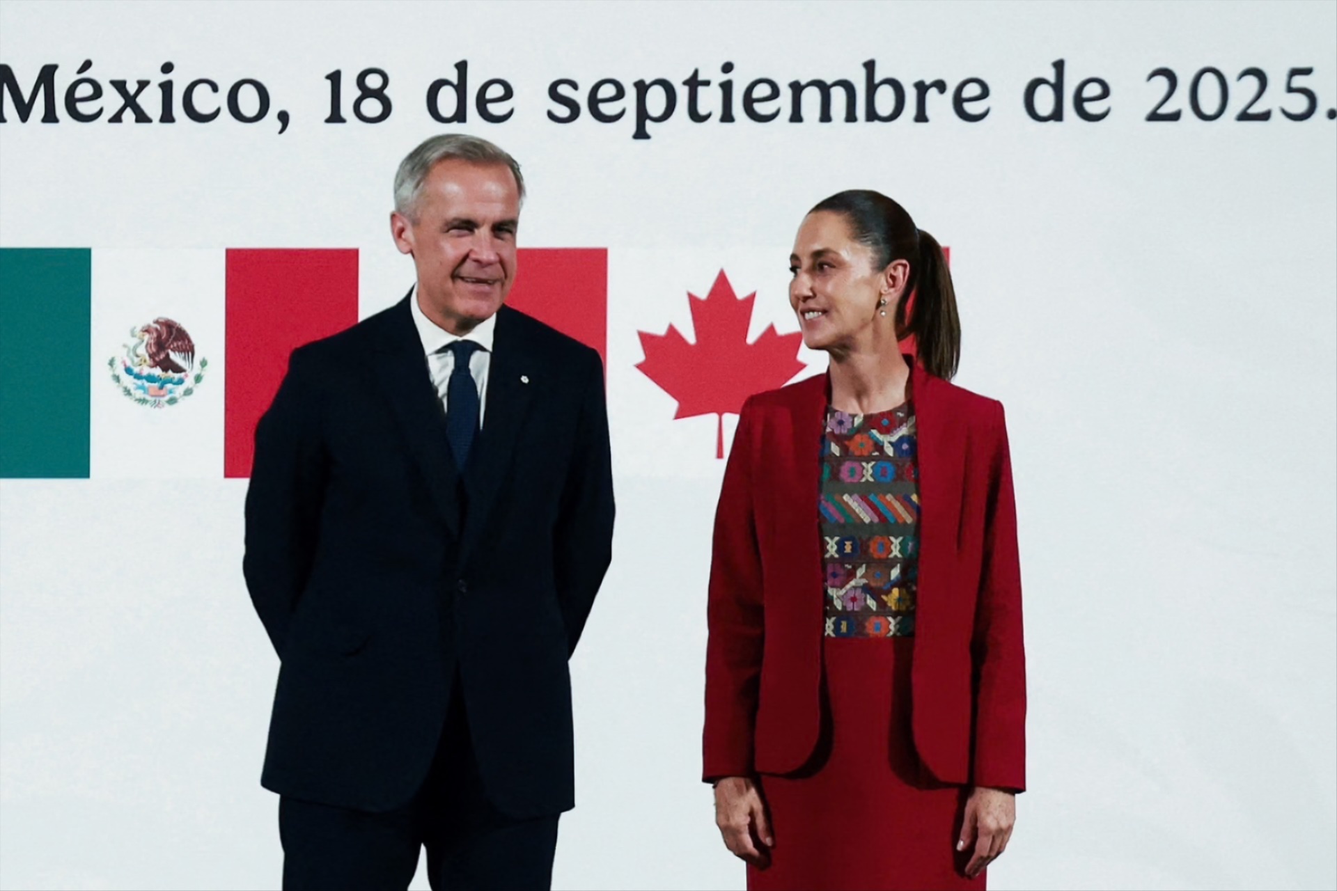 Mexican President Claudia Sheinbaum stands next to Canadian Prime Minister Mark Carney as they hold a press conference at the National Palace, in Mexico City, Mexico, on September 18, 2025. 