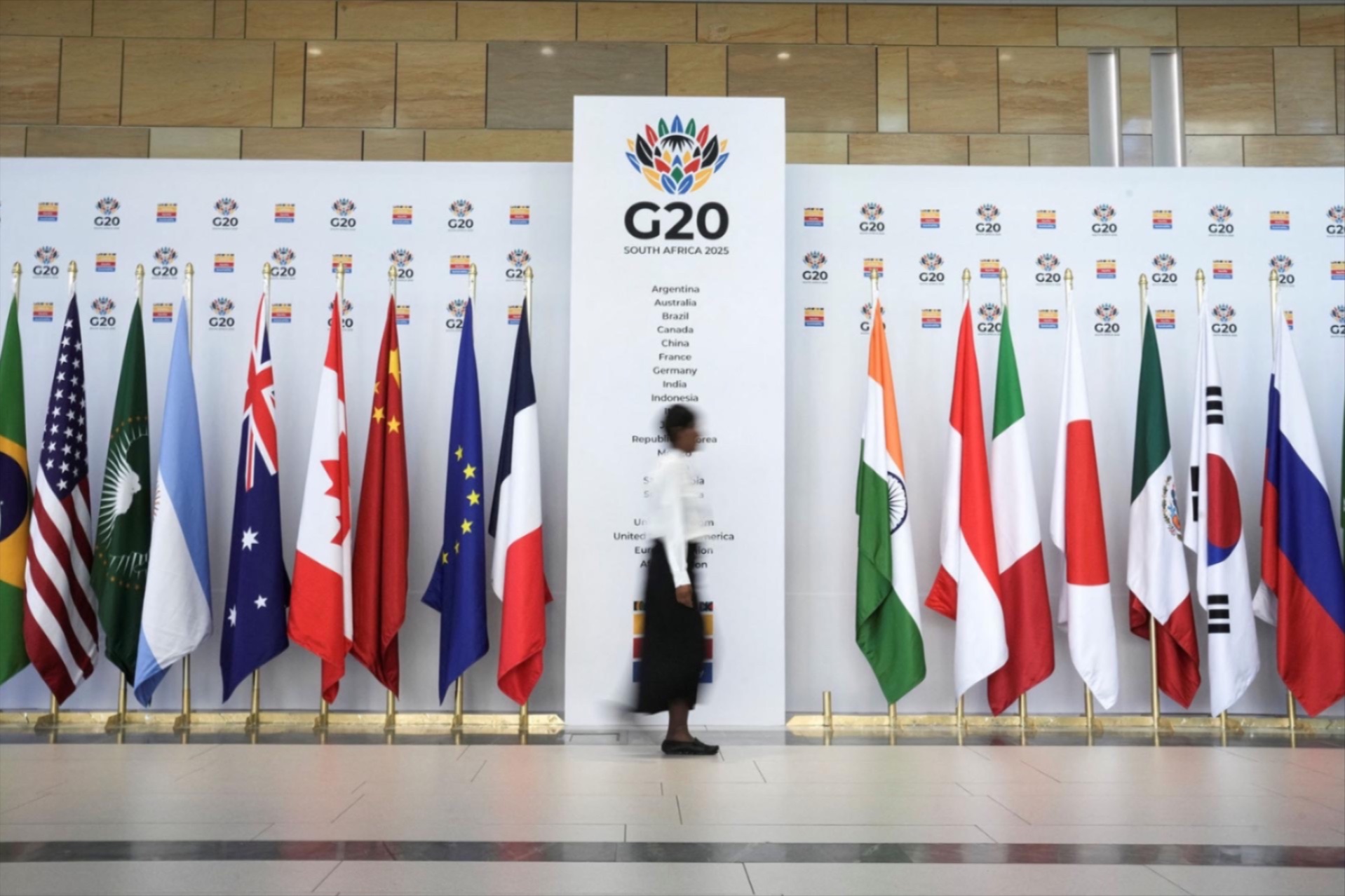 A woman walks at the Cape Town International Convention Center during the G20 Finance Ministers meeting. 