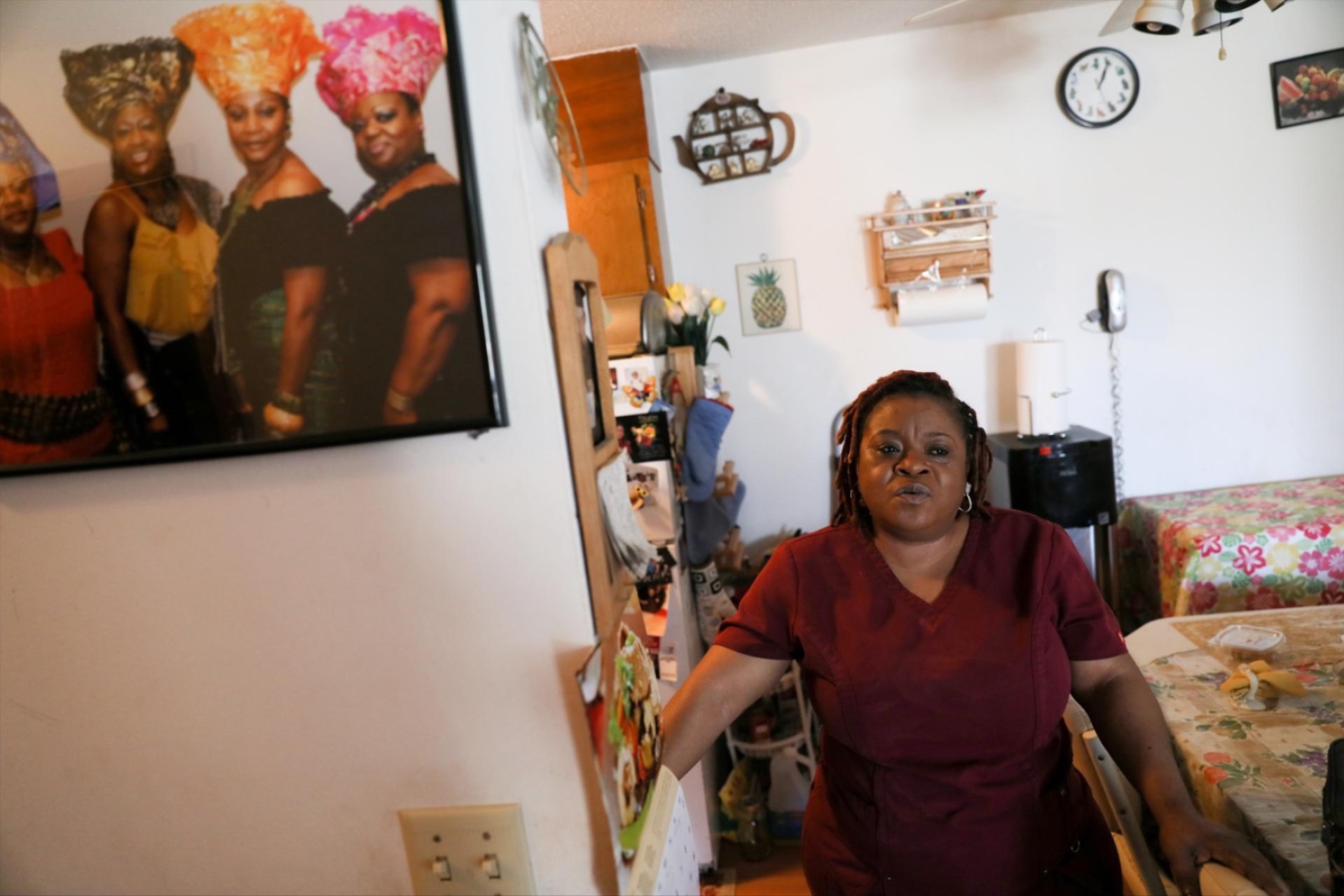 Deferred Enforced Departure status holder Marie Zar, who works as a nurse's assistant, gets ready for work, in Brooklyn Center, Minnesota, on March 29, 2019.