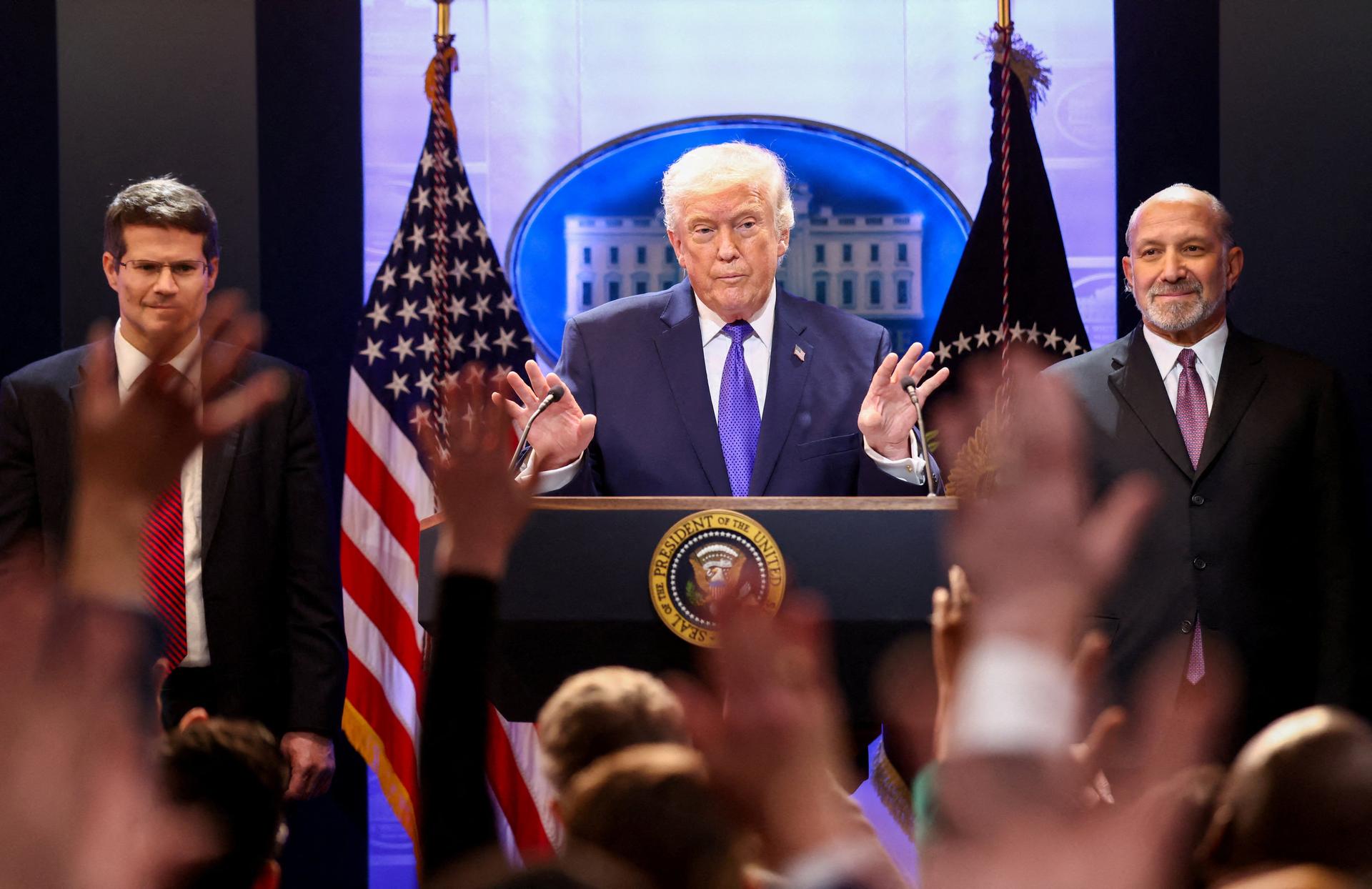 U.S. President Donald Trump, Secretary of Commerce Howard Lutnick and Solicitor General D. John Sauer at a White House press briefing following the Supreme Court’s ruling, February 20, 2026. Kevin Lamarque/Reuters