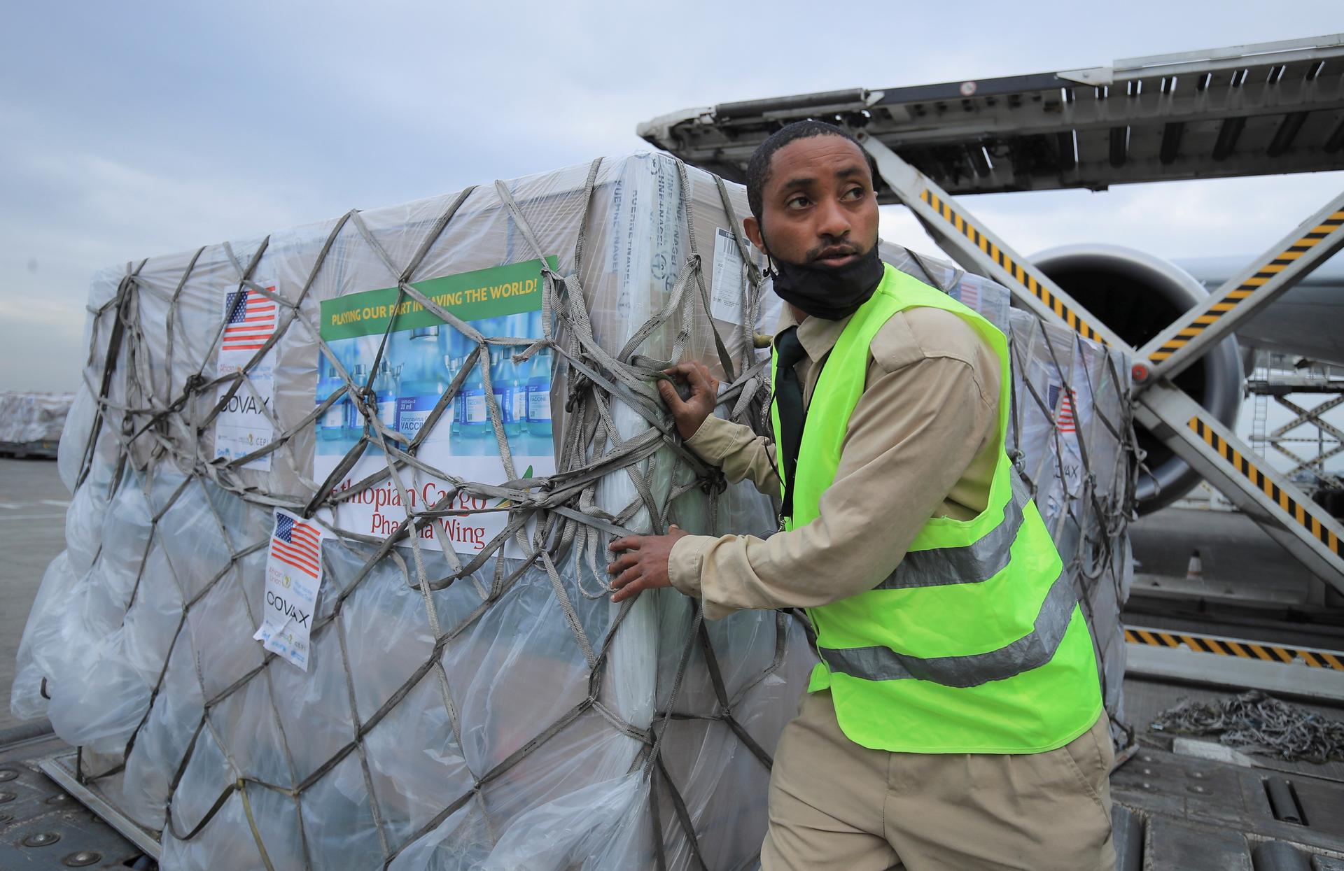 A man unloading COVID-19 vaccines
