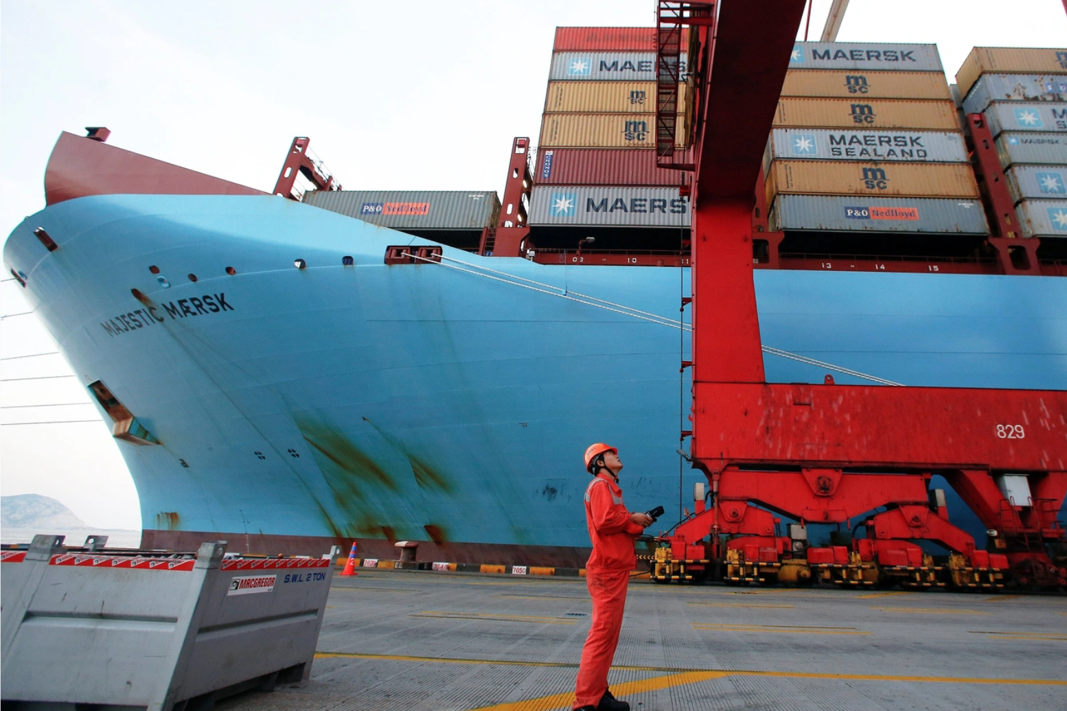 A worker is seen next to the Maersk's Triple-E giant container ship Maersk Majestic, one of the world's largest container ships, in part of the Shanghai Free Trade Zone, in Shanghai, China, on September 24, 2016. Aly Song/Reuters