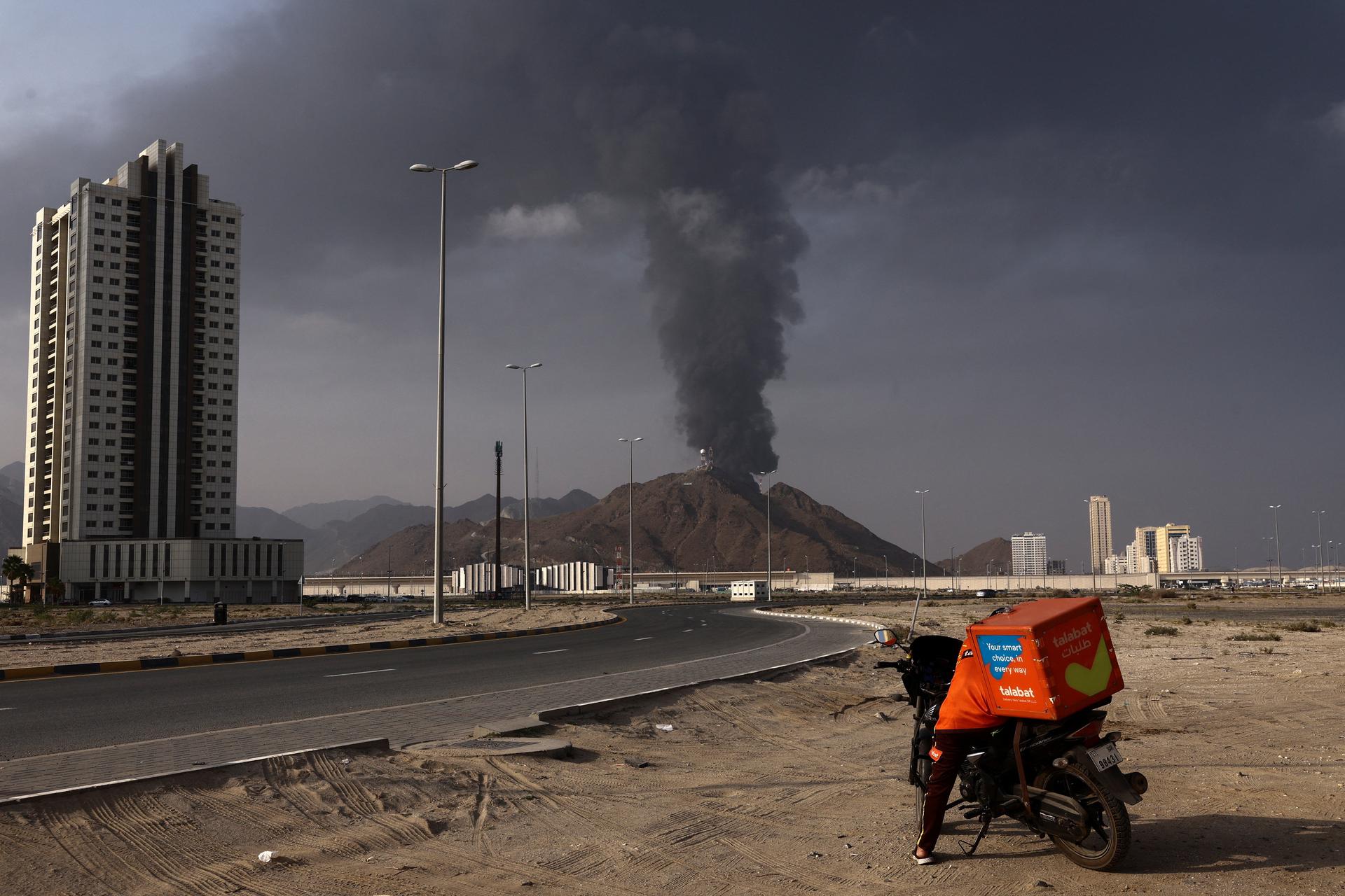 Smoke rises in the Fujairah oil industry zone following a fire caused by debris after interception of a drone by air defenses, in Fujairah, United Arab Emirates, March 3. REUTERS/Amr Alfiky