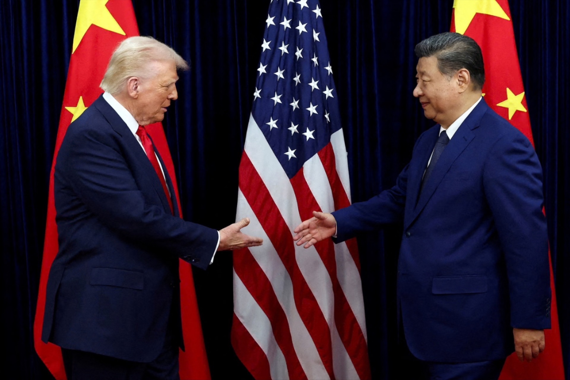 U.S. President Donald Trump shakes hands with Chinese President Xi Jinping at a bilateral meeting in Busan, South Korea, October 30, 2025.