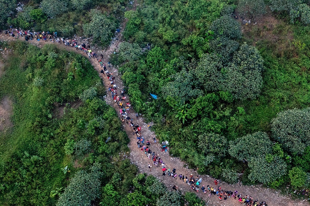 Aerial view showing migrants walking through the jungle near Bajo Chiquito village, the first border control of the Darién Province in Panama, September 22, 2023.