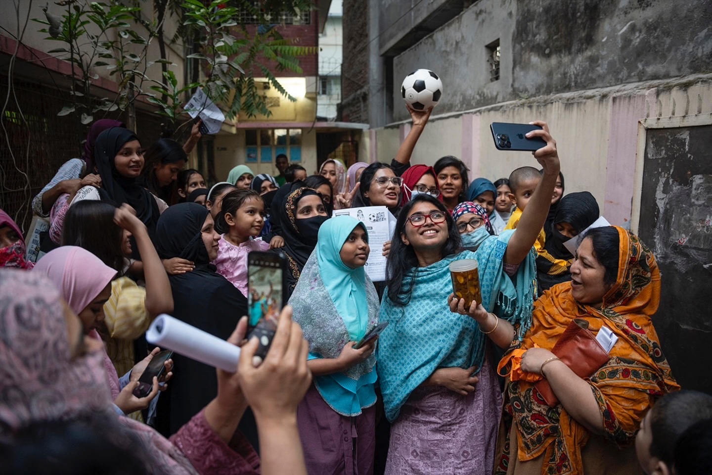Tasnim Zara, an independent candidate for parliament, takes a selfie with other young women in Dhaka, Bangladesh, February 6, 2026. 