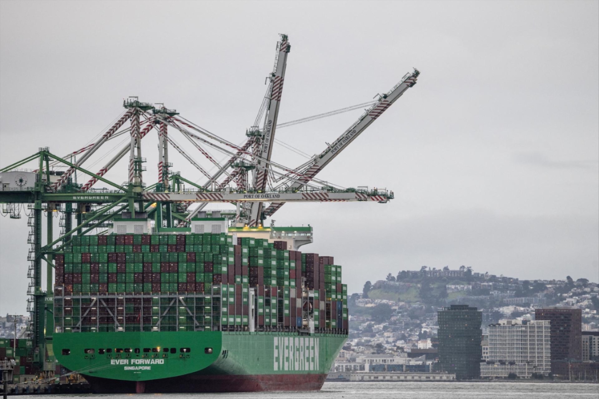 Shipping containers are stacked on a cargo ship at the port of Oakland in Oakland, California, February 24, 2026. 