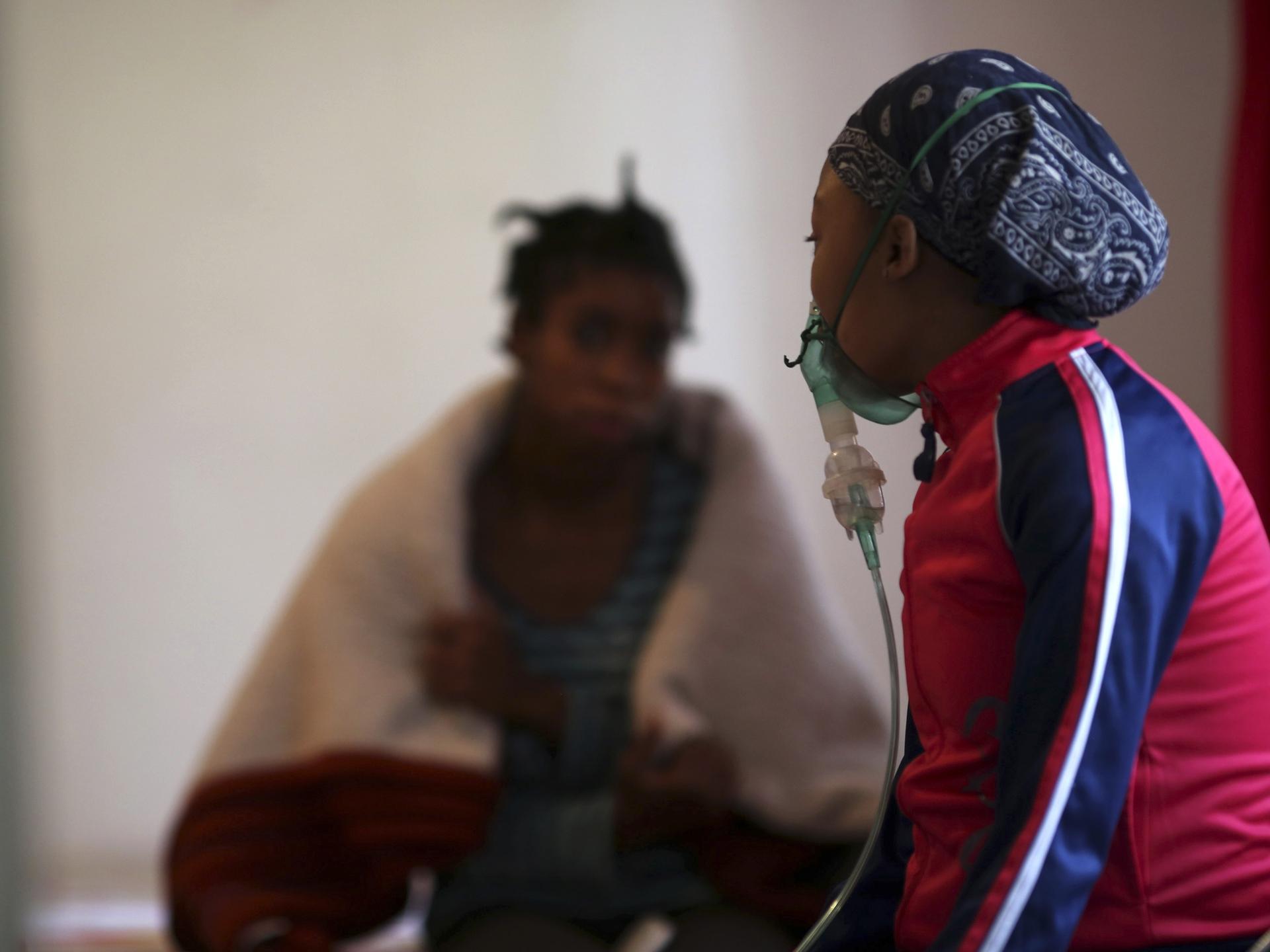 HIV patients chat at Nkosi's Haven, south of Johannesburg, South Africa, on November 28, 2014.