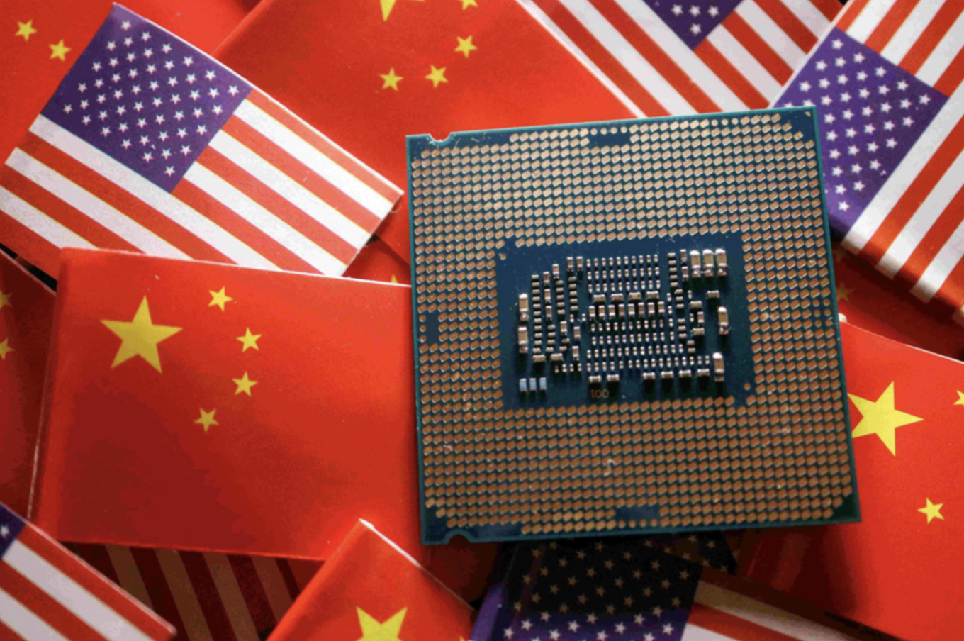 A central processing unit semiconductor chip is displayed among flags of China and U.S., in this illustration picture taken February 17, 2023. REUTERS/Florence Lo/Illustration/File Photo
