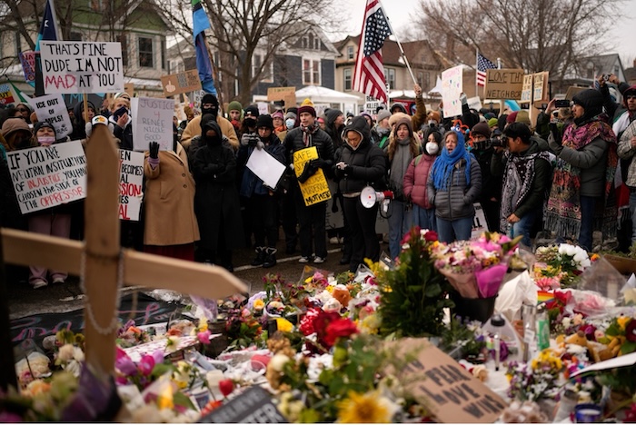 Protesters gather Saturday at the site where Renee Good was fatally shot by an ICE officer in Minneapolis. John Locher/AP