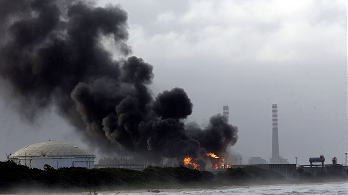 Dark smoke rises from flames from a controlled gas burning at the El Palito refinery facility, in Puerto Cabello, Carabobo state, Venezuela, in January 2020.