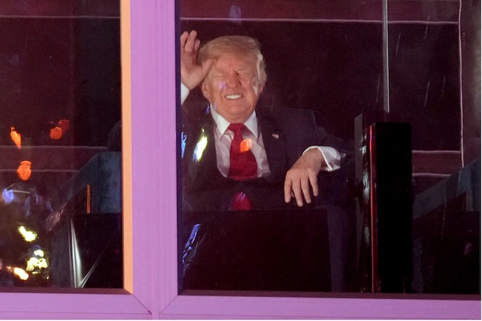 President Donald Trump watches the fireworks during the July 4th Salute to America on the National Mall in Washington, DC. Mark Schiefelbein/AP