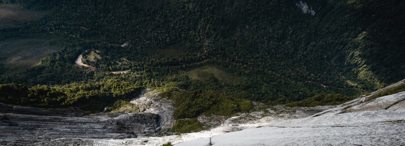 A person in a yellow shirt and white helmet