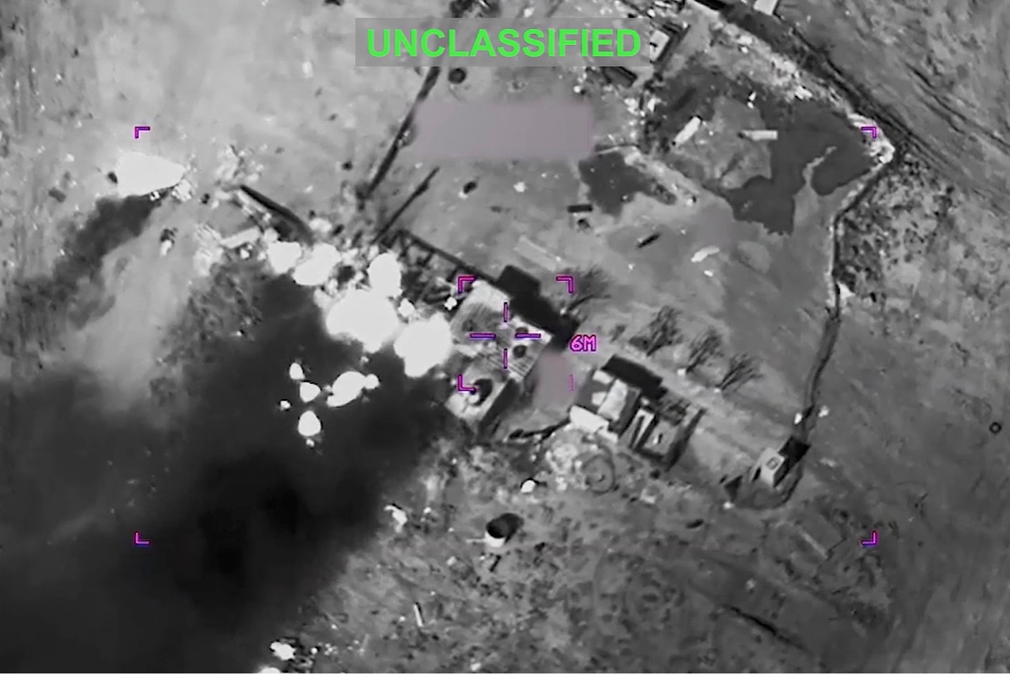This partially redacted image from video provided by US Central Command shows a complex of structures in Iran being struck by missiles fired by US forces on March 1. AP