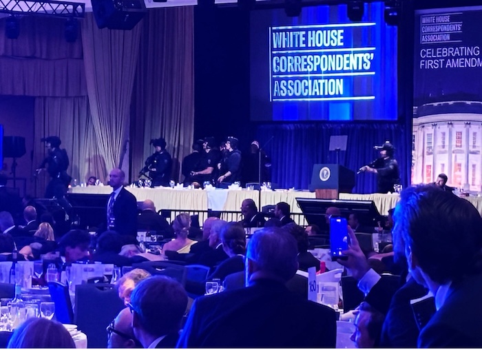 Guests and armed security agents at the White House Correspondents Dinner after a gunman shot an agent near the ballroom of the Washington Hilton on Saturday. Jason Dick/CQ Roll Call/AP