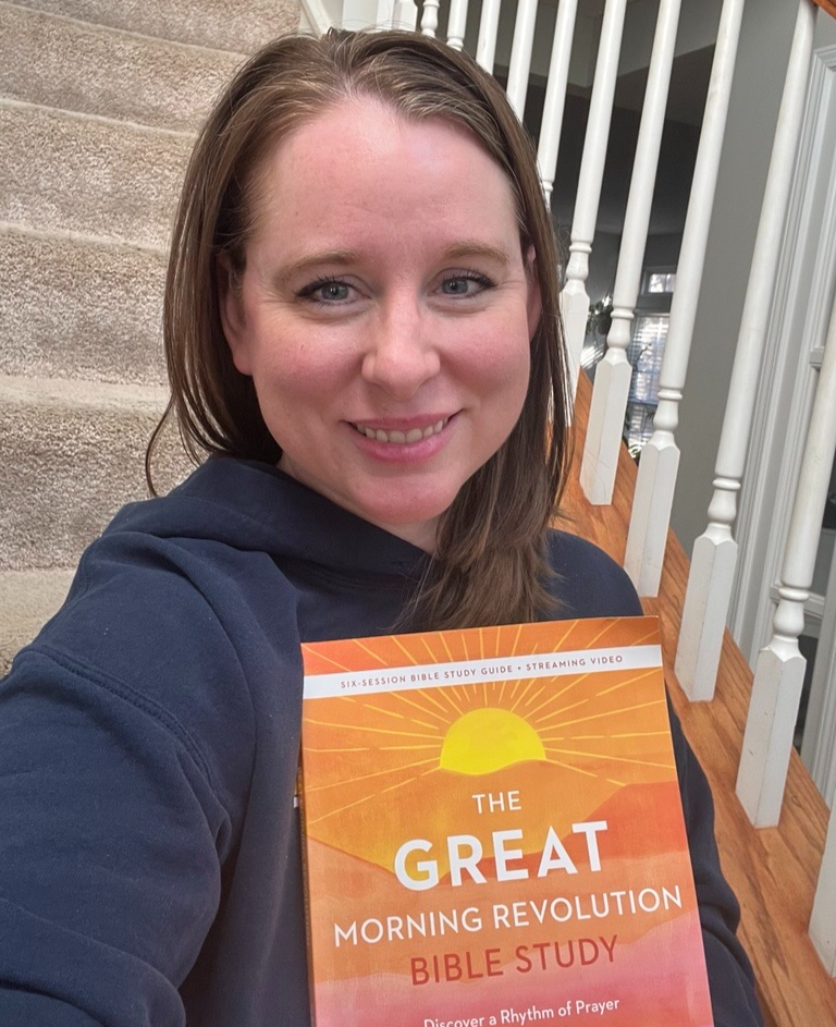 Erin holding her copy of The GREAT Morning Revolution
