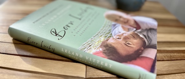 Hardcover copy of Born Lucky lying on a table