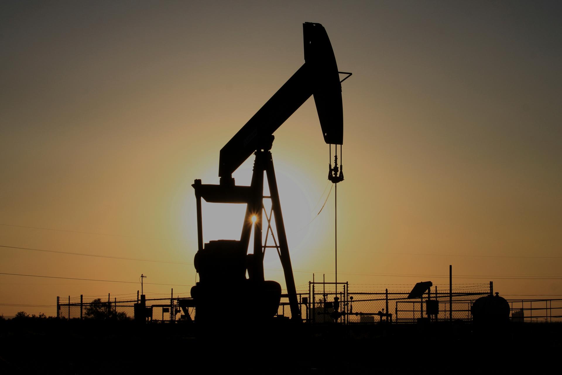 A pump jack operates at sunset in the Permian Basin near Loving, N.M., in 2025. (AP Photo/Susan Montoya Bryan)