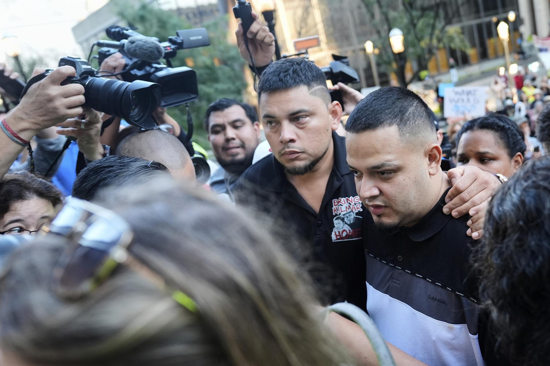 Kilmar Abrego Garcia, right, and his brother Cesar Abrego Garcia, center, arrive at the Immigration and Customs Enforcement field office in Baltimore on Monday. (AP Photo/Stephanie Scarbrough)