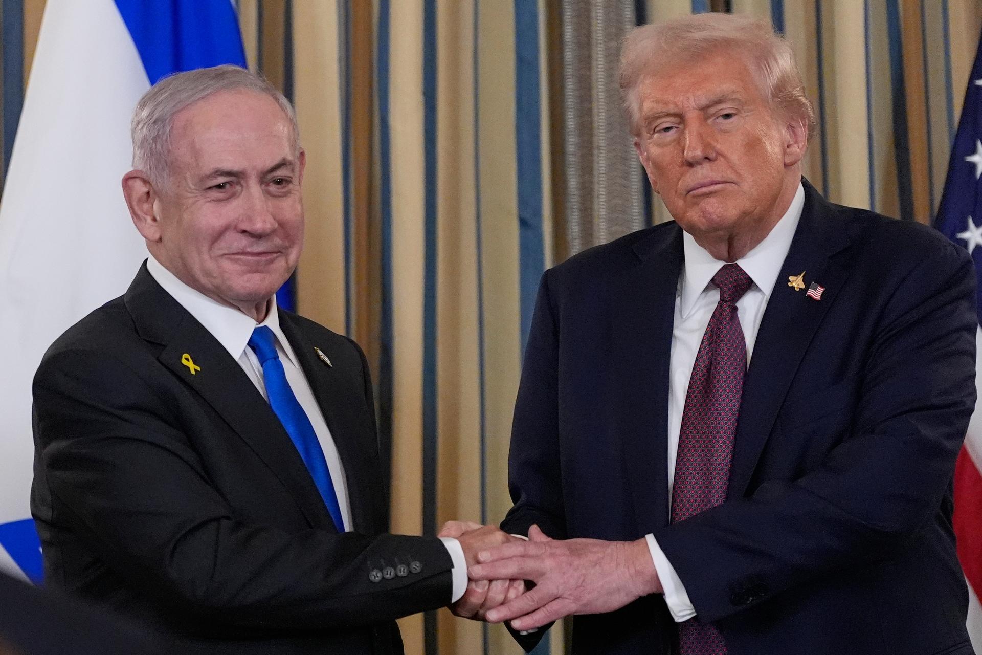 Israel's Prime Minister Benjamin Netanyahu shakes hands with President Donald Trump after a news conference in the State Dining Room of the White House on Monday. (AP Photo/Alex Brandon)