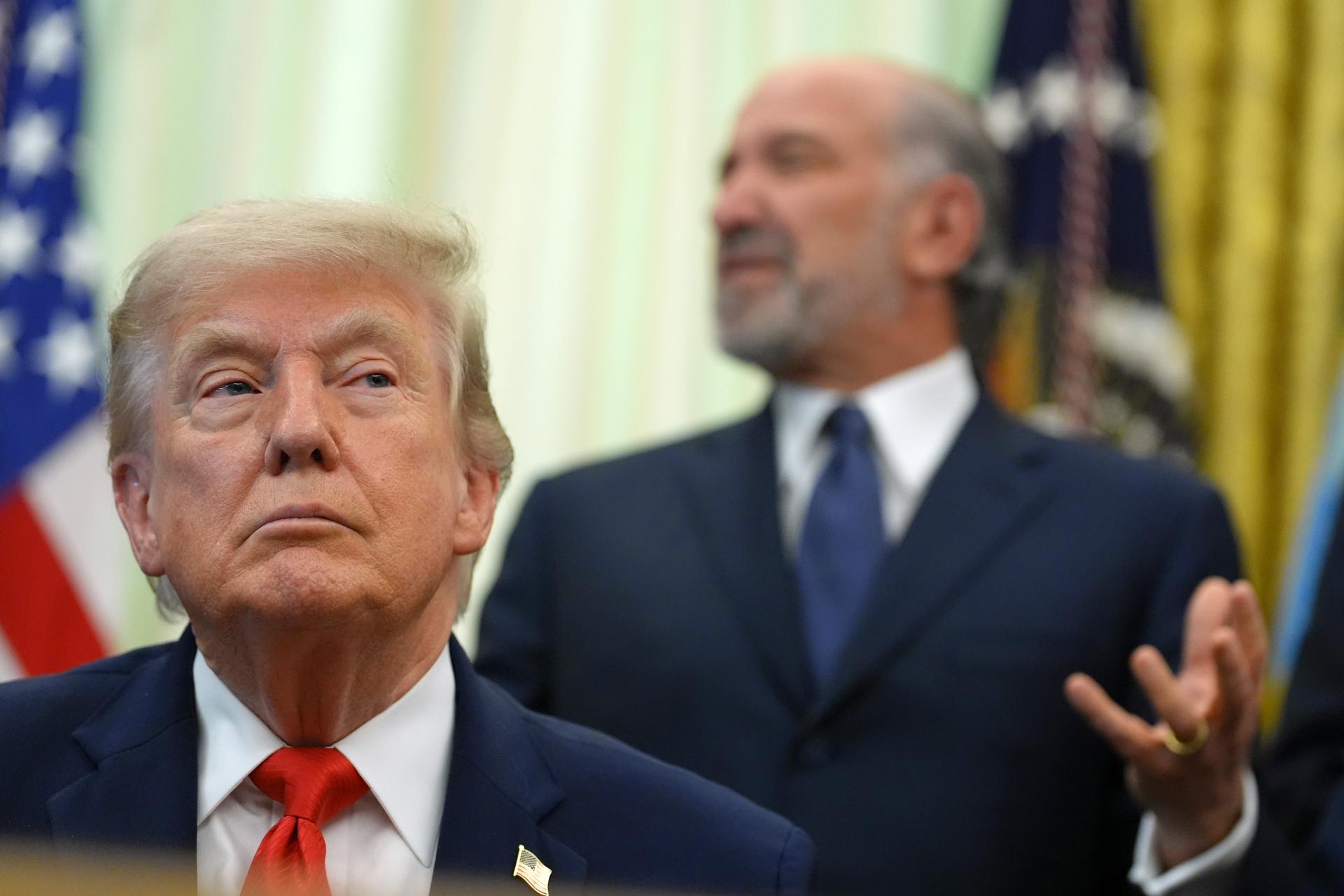 Commerce Secretary Howard Lutnick speaks alongside President Donald Trump in the Oval Office of the White House, Thursday, in Washington.