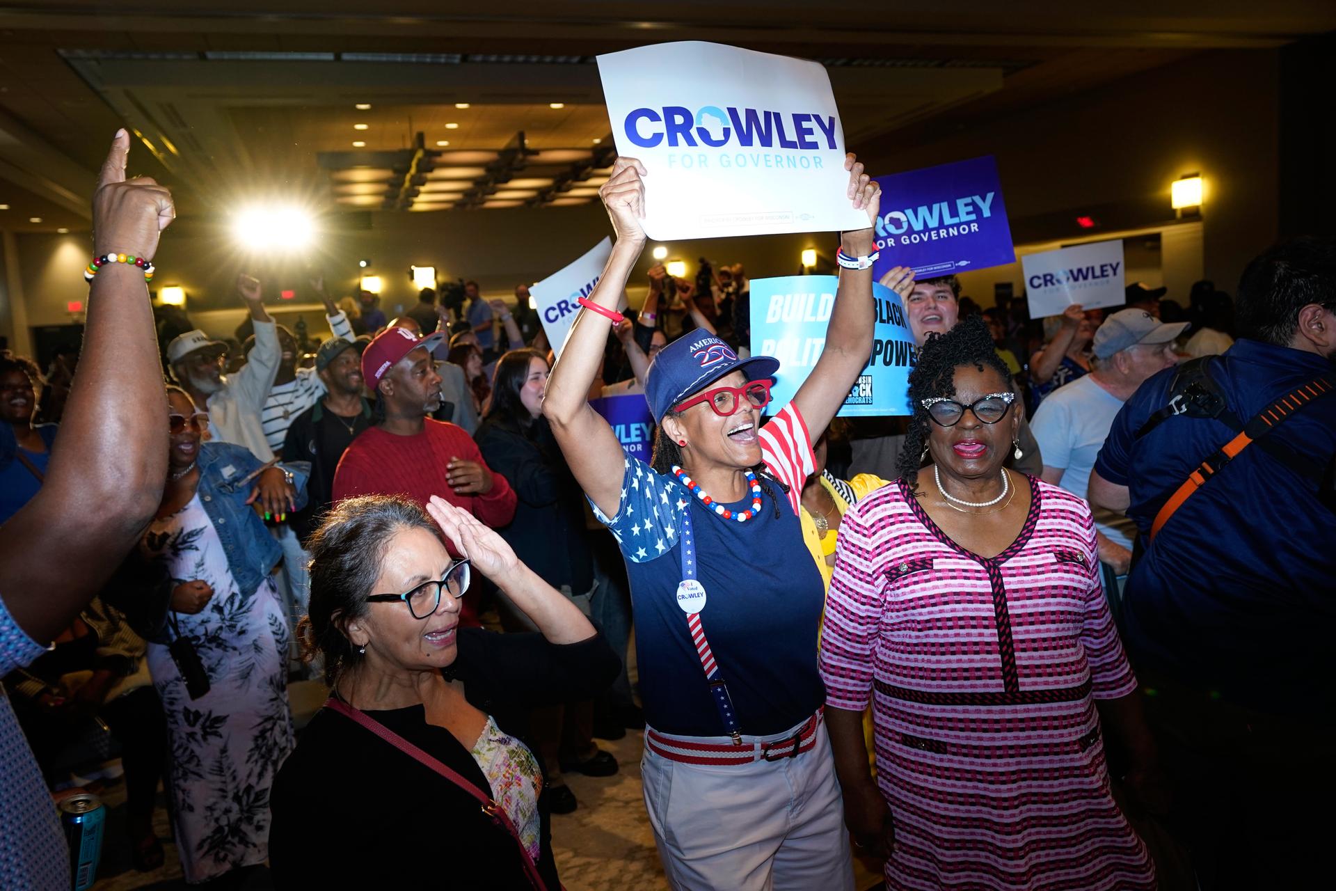 Supporters react to election results coming in during a primary election night watch party for Democratic gubernatorial candidate David Crowley, Tuesday, in Milwaukee, Wis. 