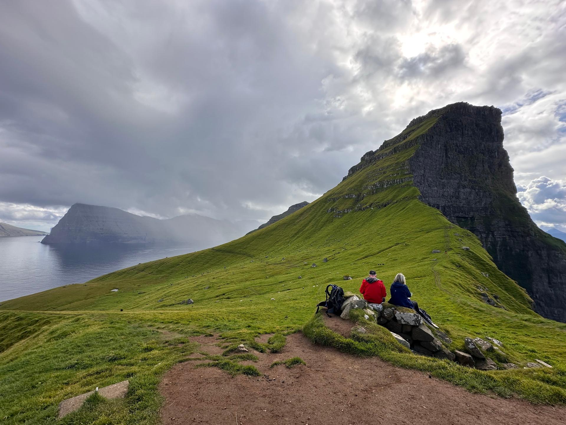 Tourists enjoy a view on Kalsoy Island at the Faroe Islands on Sept. 4. (AP Photo/Cara Anna)