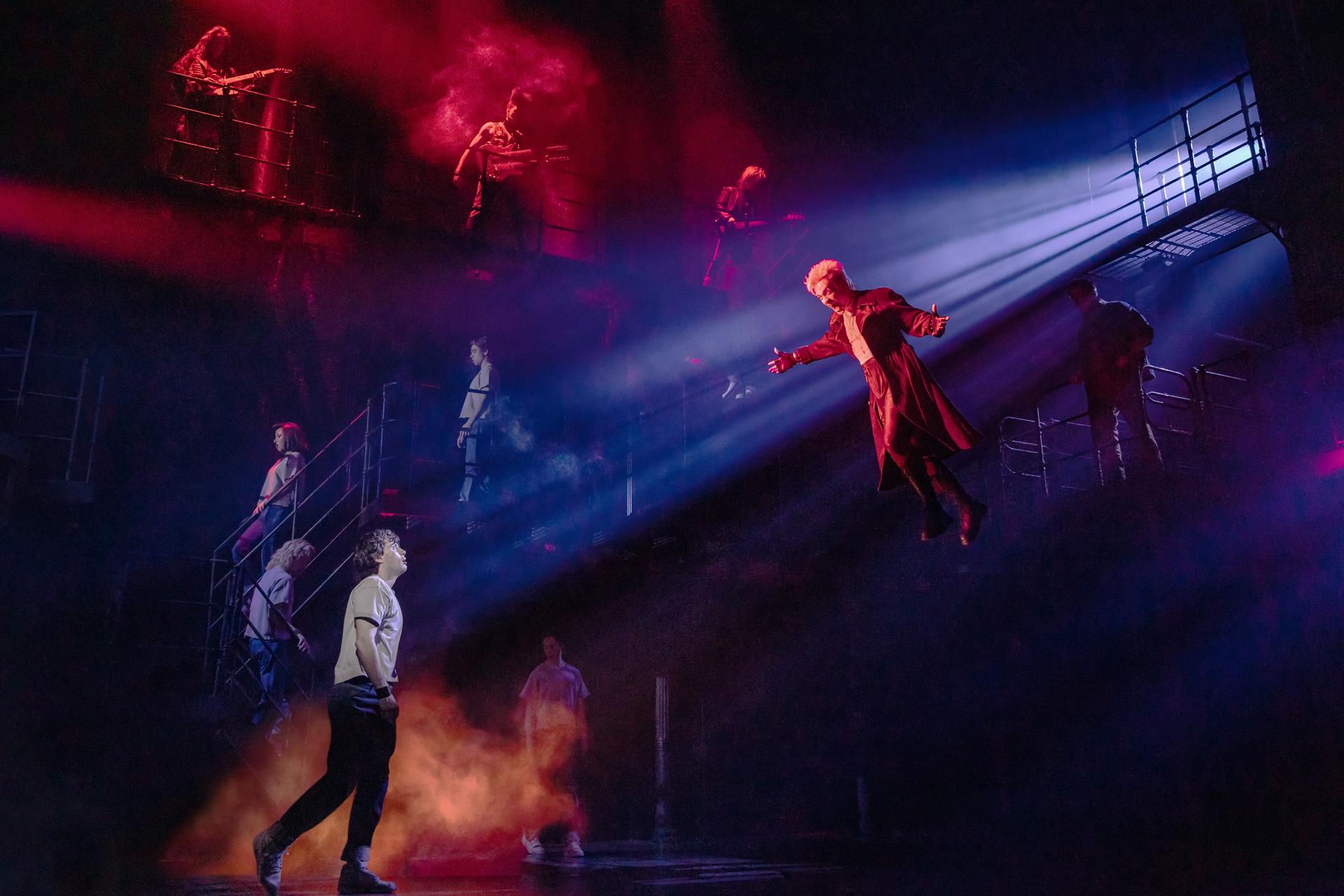 L.J. Benet, foreground left, and Ali Louis Bourzgui, suspended right, appear with the Broadway cast of “The Lost Boys” during a performance in New York on March 25. 