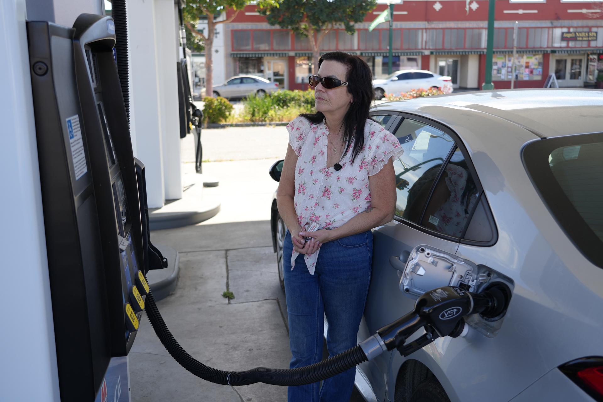 Leslie Sherman-Shafer, an Uber driver, fills up her car at a gas station in Alameda, Calif, March 23.