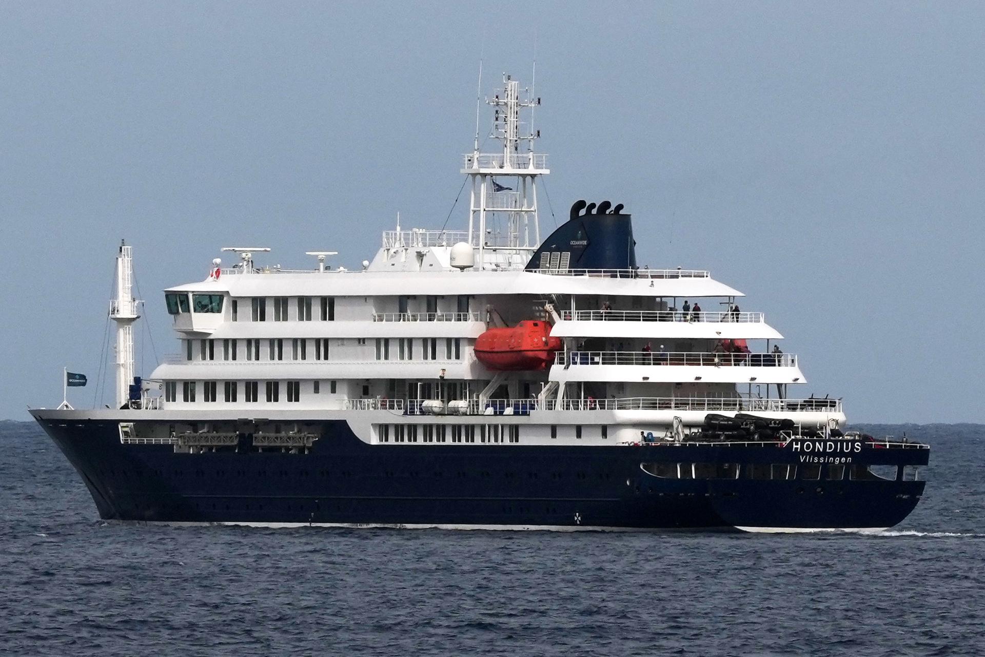 The MV Hondius cruise ship departs the port in Praia, Cape Verde, on Wednesday. (AP Photo/Misper Apawu)