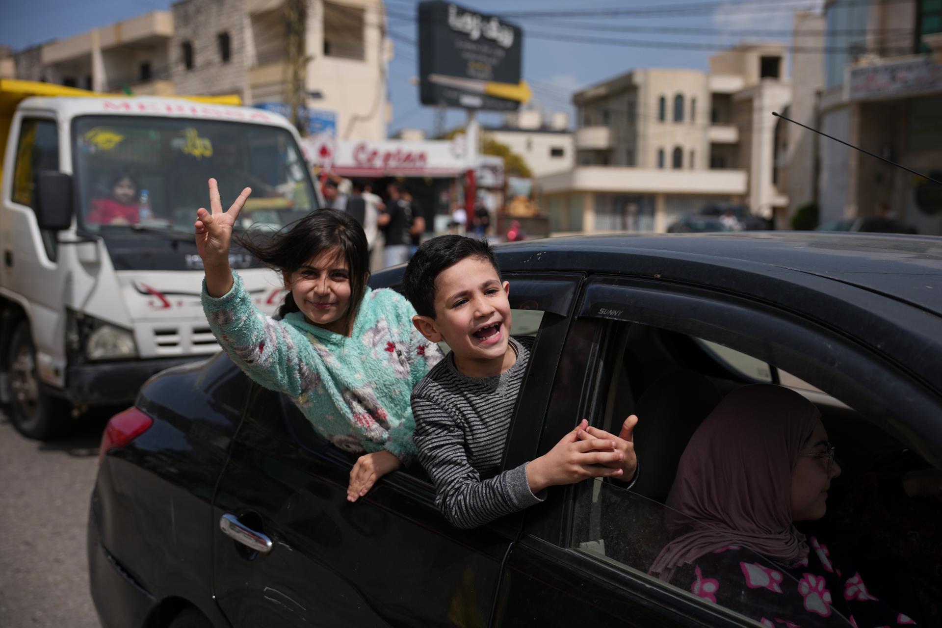 Displaced residents celebrate as they return to their villages following a ceasefire between Israel and Hezbollah, in Zefta, southern Lebanon, Friday.