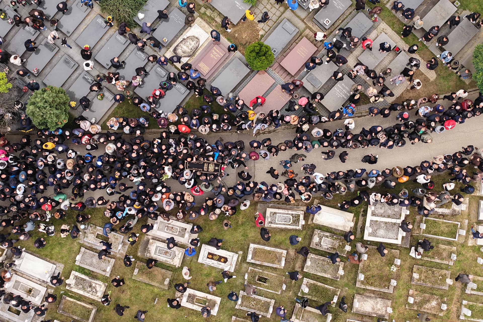 Thousands of people attend the funeral of popular Bosnian folk singer Halid Beslic in Sarajevo, Bosnia, on Monday. (AP Photo/Armin Durgut)
