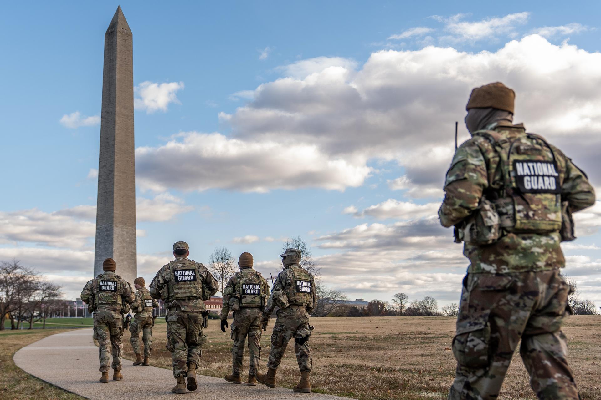 National Guardsmen patrol in front of the Washington Monument on Friday. (AP Photo/Julia Demaree Nikhinson)