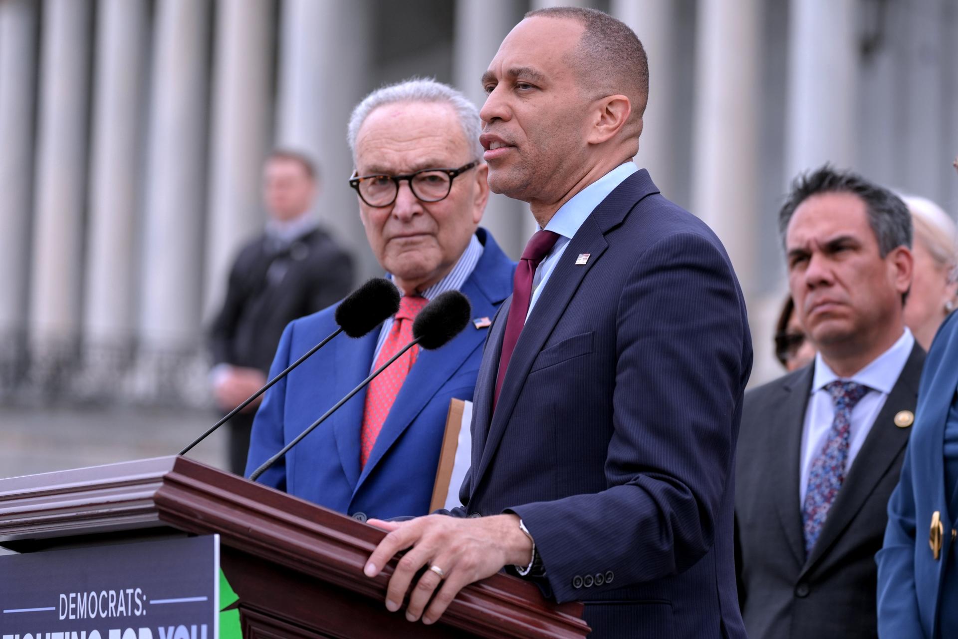 House Minority Leader Hakeem Jeffries, D-N.Y., center, speaks Thursday, on Capitol Hill, in Washington. 