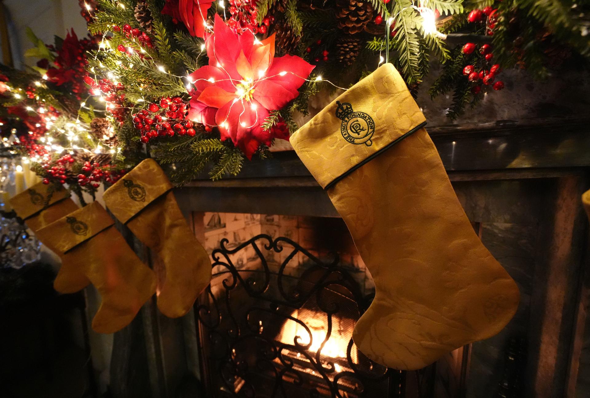 Christmas stockings created by members of the King's Foundation Sewing Bee group at Dumfries House in Scotland on Tuesday. (Andrew Milligan/PA via AP)