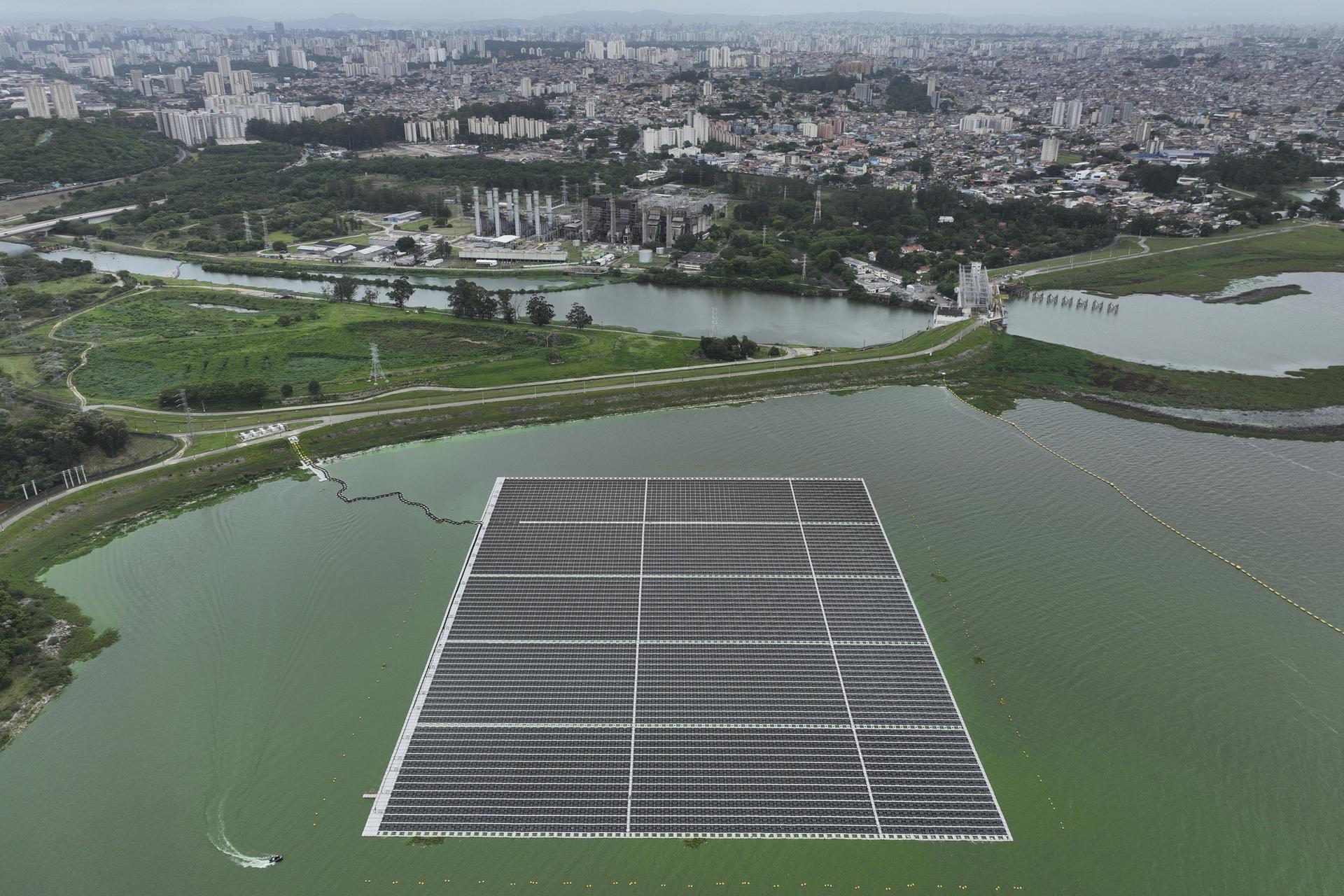 A floating solar farm operates at the Billings Reservoir in Sao Paulo on Thursday. (AP Photo/Andre Penner)