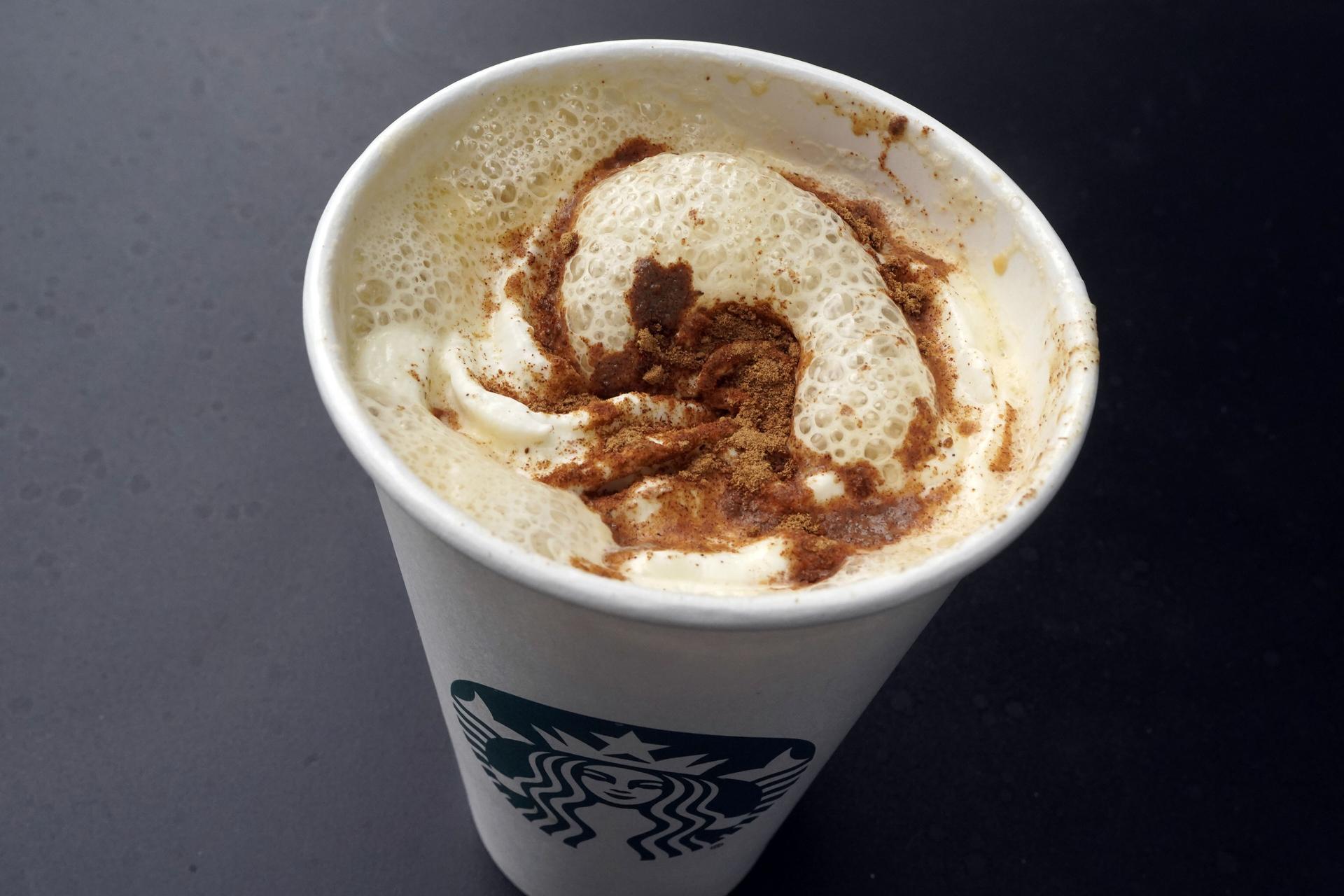 A Pumpkin Spice Latte drink rests on a table at a Starbucks in New York. (AP Photo/Richard Drew)