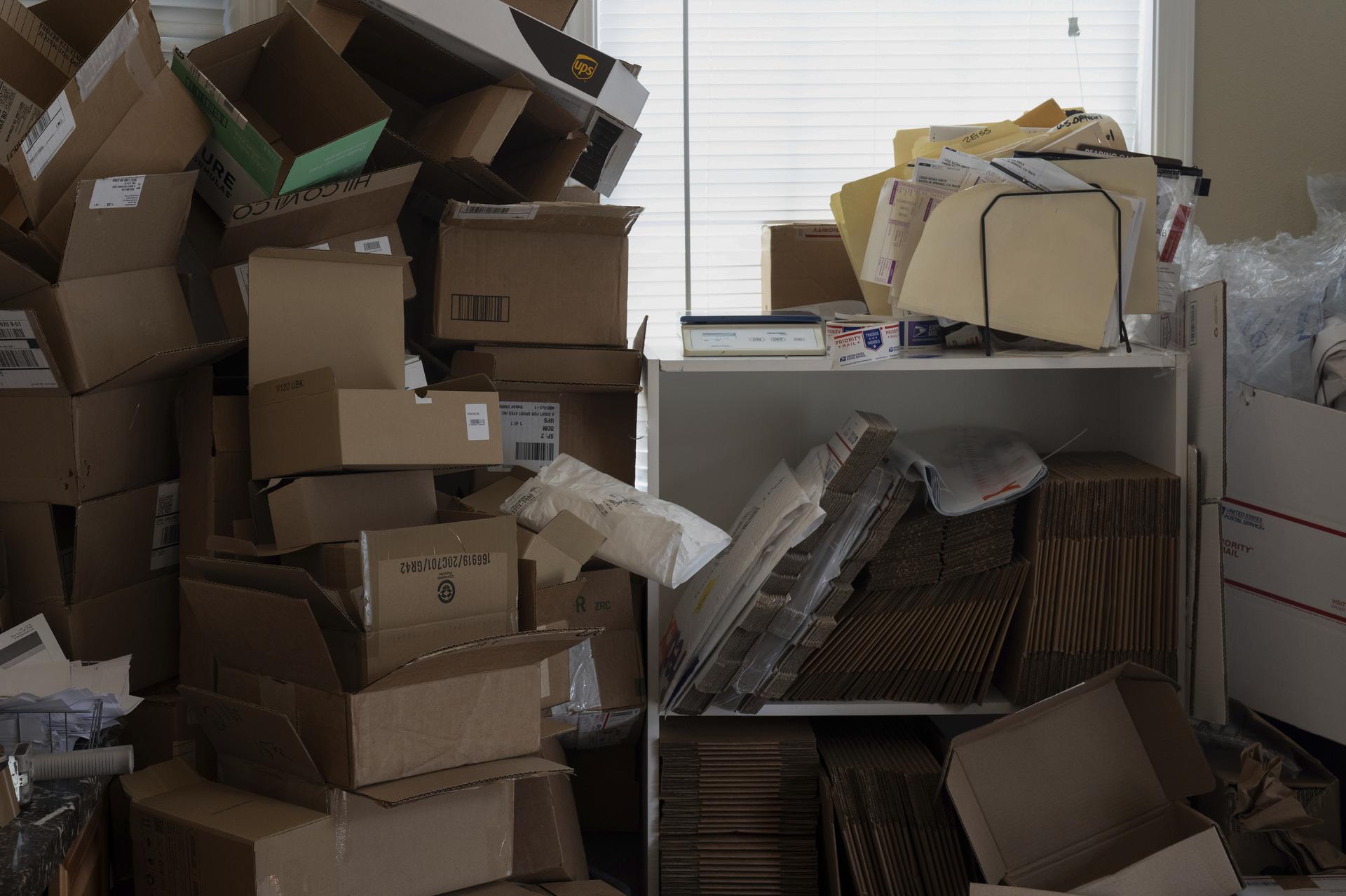 Empty boxes are stacked for reuse at A Sight For Sport Eyes, a brick-and-mortar and e-commerce store, on Wednesday. (AP Photo/Jenny Kane)