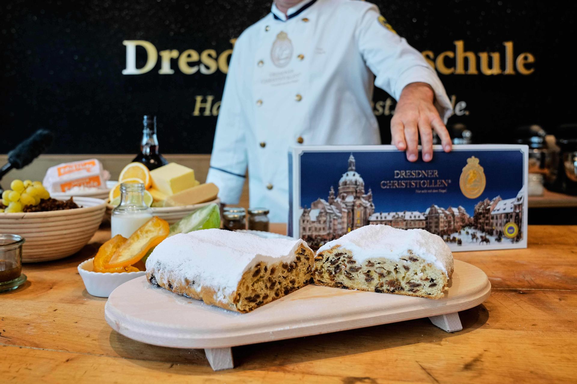 A stollen pastry, a traditional Christmas pastry, sits on a table in a bakery along with pastry ingredients in Dresden, Germany, Nov. 11, 2025.