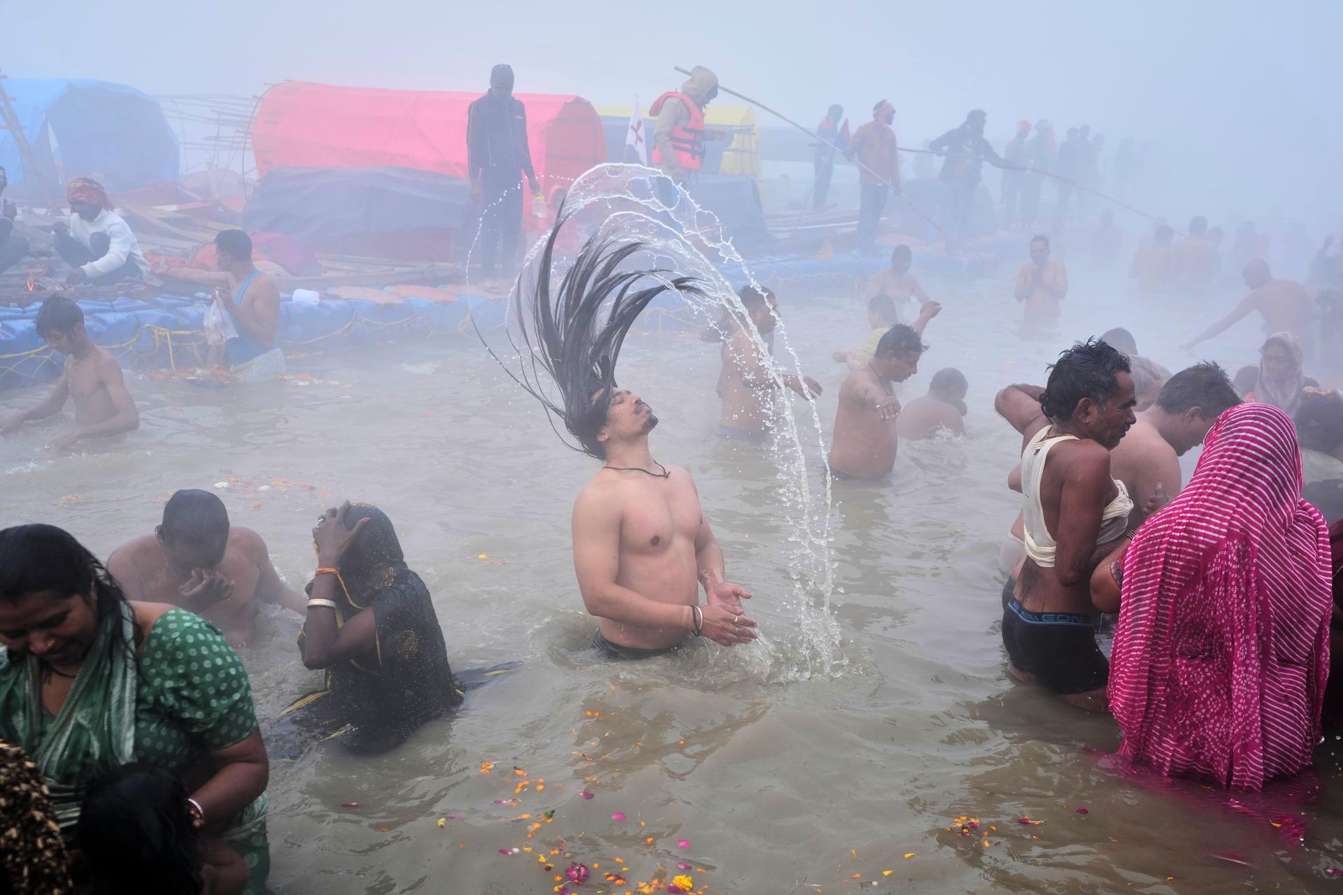 Devotees take a holy dip on Mauni Amavasya in Prayagraj, India, on Sunday. (AP Photo/Rajesh Kumar Singh)