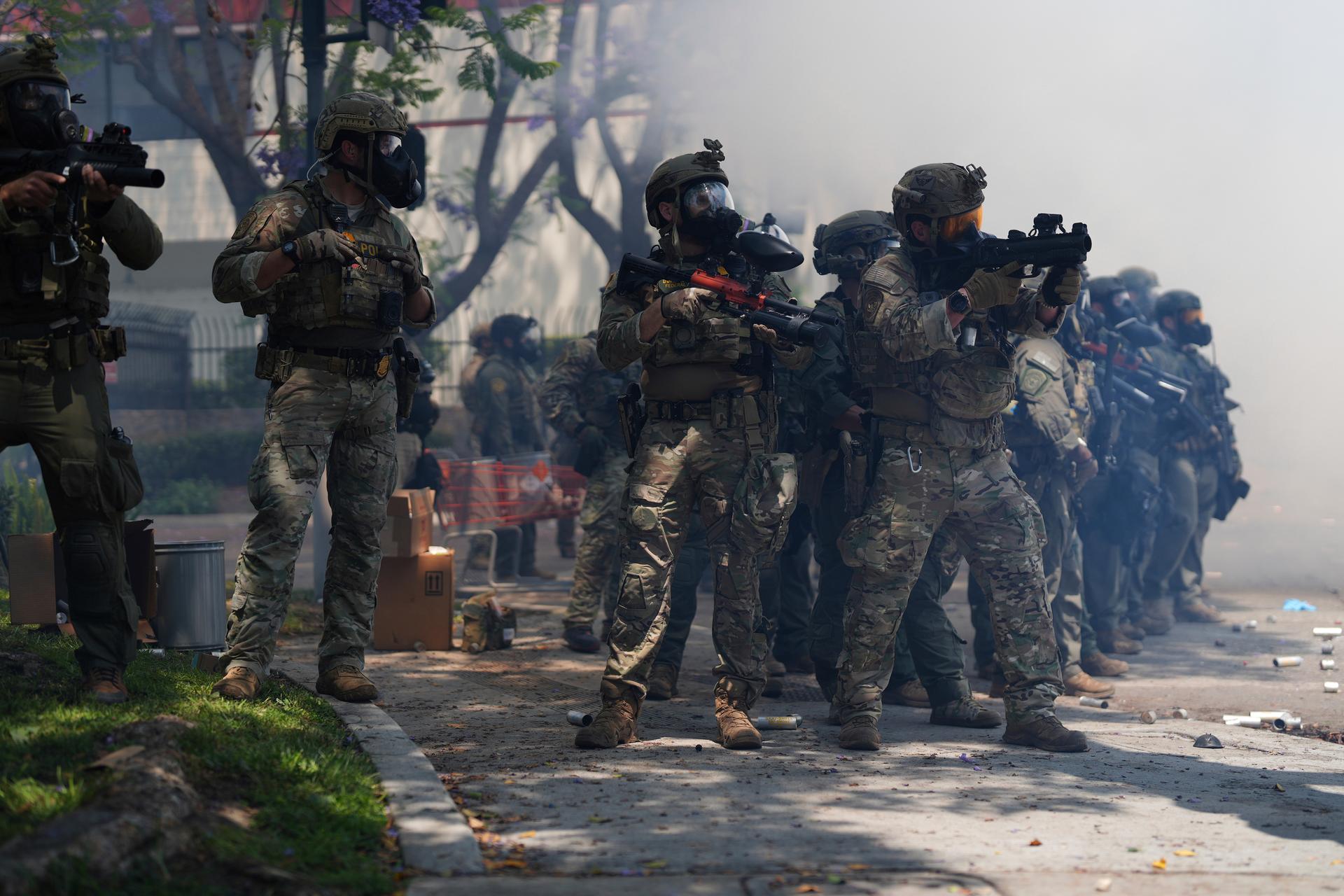 Law enforcement responds to protesters after federal immigration authorities conducted operations in Paramount, Calif., in June 2025. (AP Photo/Eric Thayer)